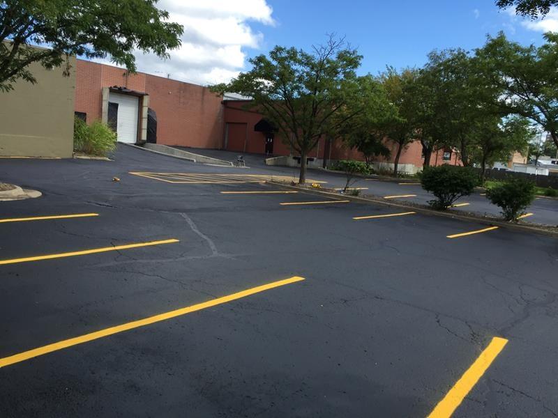 Patched, Crack Filled & Reapplied Stripes for parking lot in Overland Park, KS Thumbnail